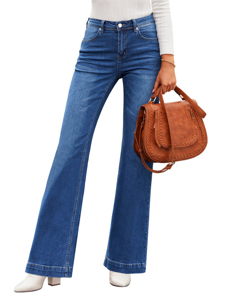 Front view of model poses wearing blue mid-waist stretchable straight leg denim jeans