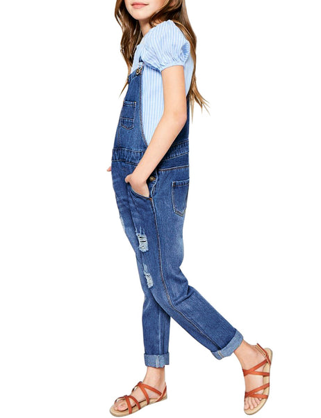 Side view of model wearing dark blue cuffed hem distressed girls' denim jeans overall