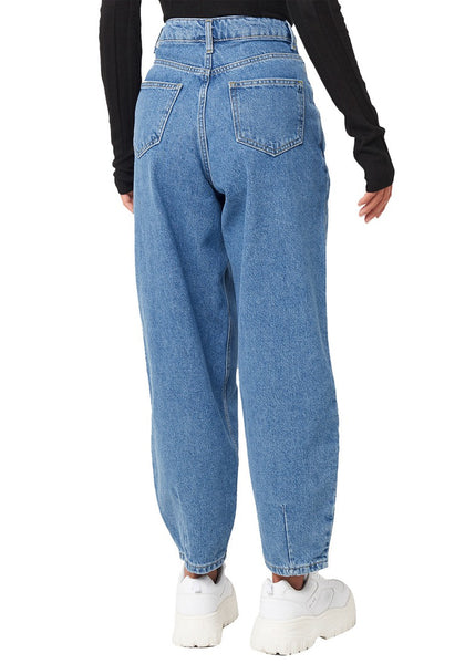 Back view of model wearing blue high-waist loose denim mom jeans