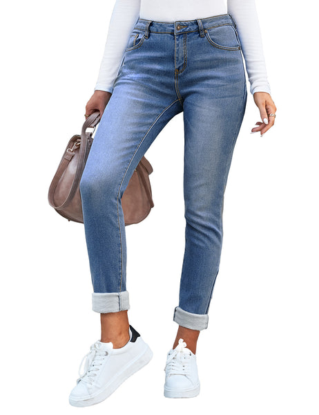Posing model wearing dark blue mid-waist skinny fit denim jeans