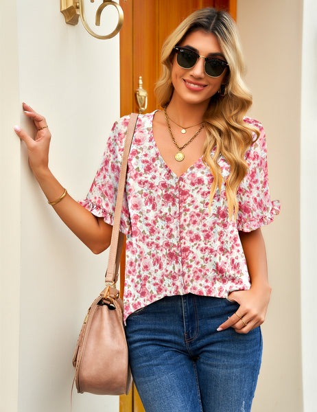 Front view of model wearing pink ruffle trim short sleeves printed v-neck button-down top