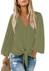 Front view of model wearing sage green V-neckline button loop loose top