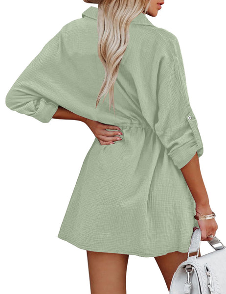 Back view of model wearing mint cuffed long sleeves elastic-waist shirt dress