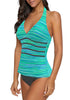 Angled shot of model wearing aqua abstract stripes halter V-neck tankini set