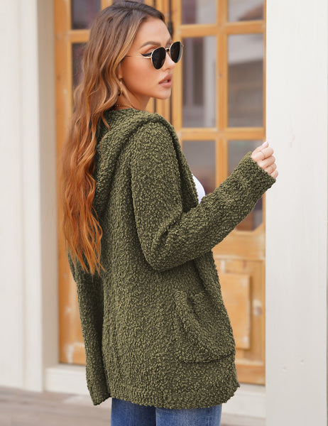 Side view of model wearing army green button down melange waffle knit hooded cardigan
