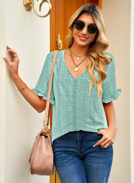 Front view of model wearing light green ruffle trim short sleeves printed V-neck button-down top