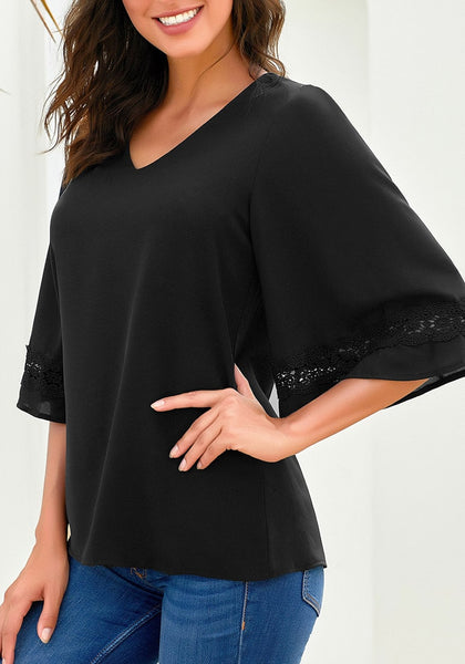 Angled shot of model wearing black V-neckline crochet lace trim sleeves loose blouse