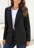 Angled shot of model wearing black lapel front-button side-pockets blazer
