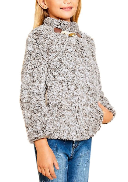 Angled shot of model wearing grey mock neck toggle buttons fleece girls sweater