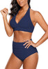 Angled shot of model wearing navy halter ruched high-waist bikini set