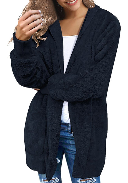 Angled shot of model wearing navy snuggle fleece oversized hooded cardigan