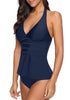 Angled shot of model wearing navy solid color halter tankini set