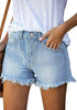 Angled shot view of model wearing light blue frayed hem washed denim jeans shorts