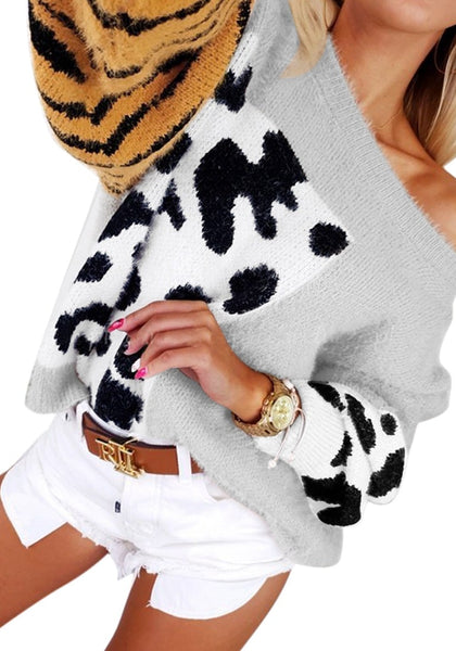 Angled view of model wearing grey animal-print colorblock batwing sleeves sweater