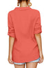 Back view of model earing coral collared V-neckline cuffed sleeves button-up top