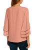 Back view of model in pink 34 bell mesh panel sleeves strappy V-neckline loose top