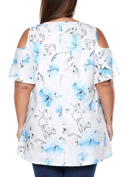 Back view of model in plus size light blue floral cold-shoulder blouse