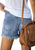 Back view of model wearing blue frayed hem washed denim jeans shorts