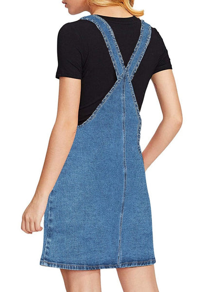 Back view of model wearing blue side pockets overall denim pinafore dress