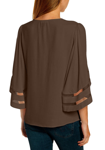 Back view of model wearing brown 3/4 bell mesh panel sleeves V-neckline loose top