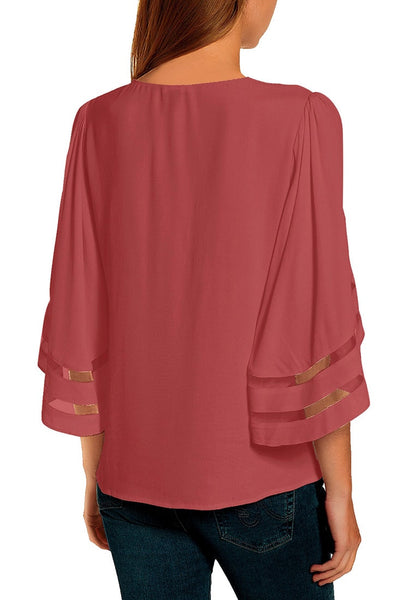 Back view of model wearing coral pink 34 bell mesh panel sleeves crew neck loose top