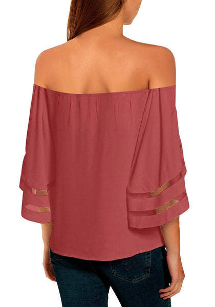 Back view of model wearing coral pink 34 bell mesh panel sleeves tie-front off-shoulder top