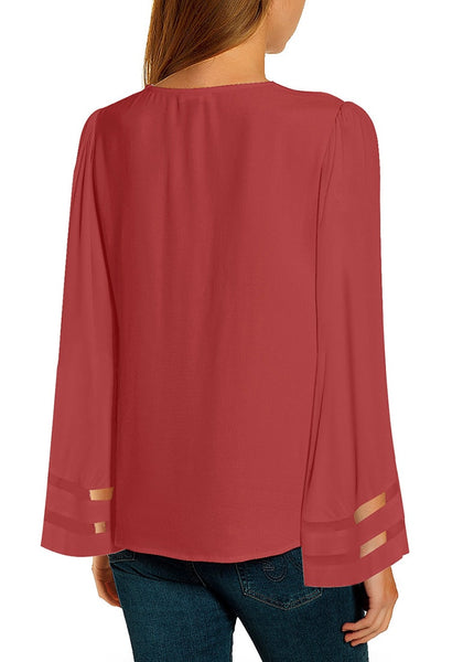 Back view of model wearing coral pink overlap V-neckline long bell mesh sleeves loose top