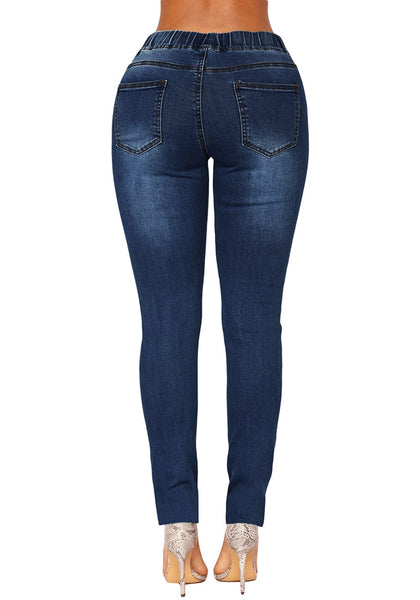 Back view of model wearing dark blue drawstring-waist washout ripped skinny jeans
