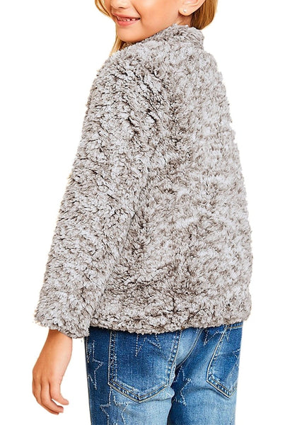 Back view of model wearing grey mock neck toggle buttons fleece girls sweater