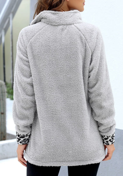 Back view of model wearing grey oblique stand collar leopard fleece pullover