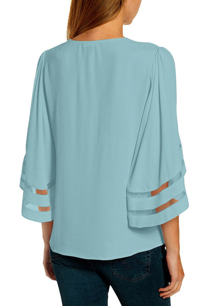 Back view of model wearing light V-neckline mesh bell sleeves loose wrap blouse