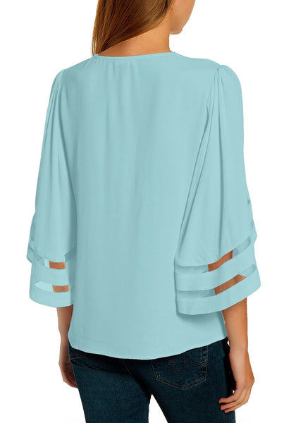 Front view of model wearing light blue 34 bell mesh panel sleeves V-neckline loose top