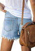 Back view of model wearing light blue frayed hem washed denim jeans shorts