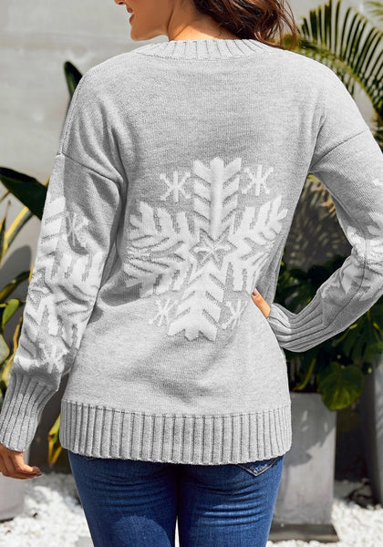 Back view of model wearing light grey snowflake ribbed knit Christmas sweater