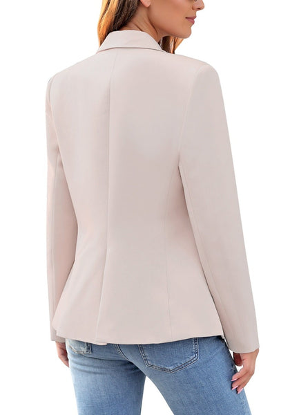Back view of model wearing light mauve notch lapel double-breasted blazer