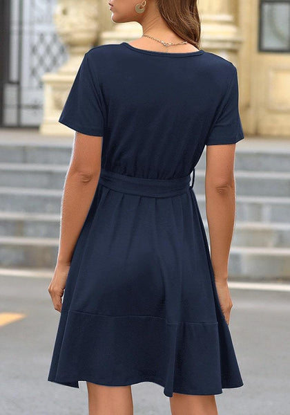 Back view of model wearing navy V-neckline short sleeves belted ruffle dress