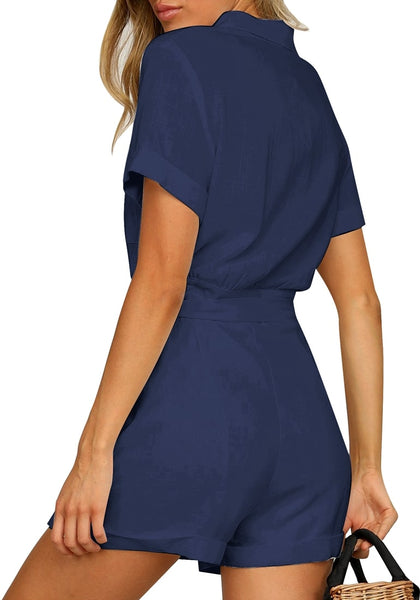 Back view of model wearing navy blue short sleeves button-down belted romper