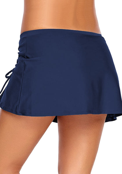 Back view of model wearing navy elastic waist slit side-drawstring skirtini bottom