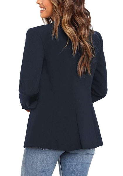 Back view of model wearing navy notch lapel double-breasted blazer