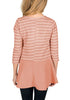 Back view of model wearing pink striped ruffle hem flared girl tunic top
