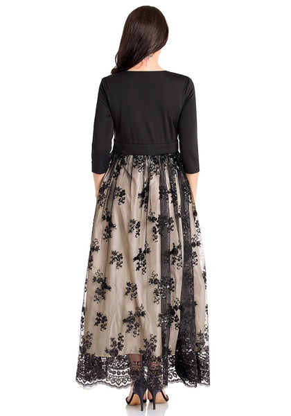 Back view of model wearing plus size black mesh floral sequin maxi  skater dress