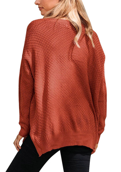 Back view of model wearing rust red ribbed knit textured side-slit sweater