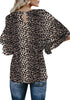 Back view of model wearing black trumpet sleeves keyhole-back leopard blouse