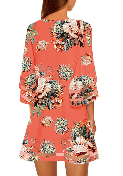 Back view of model wearing coral 3-4 bell sleeves mesh panel crew-neckline floral loose dress