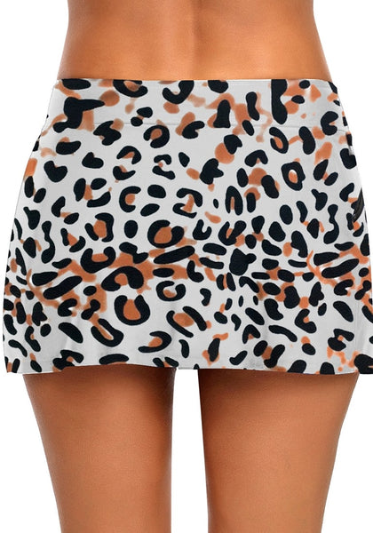 Back view of model wearing leopard print zipper-pocket waistband skirted bikini bottom