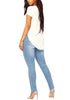 Back view of model wearing light blue drawstring-waist washout ripped skinny jeans