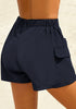 Back view of model wearing navy elastic-waist side pockets lace-up board shorts