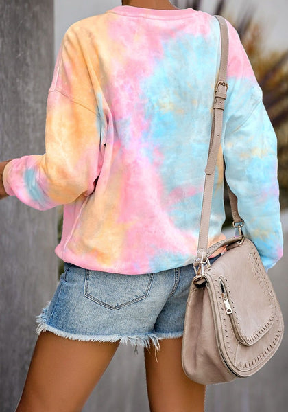Back view of model wearing pink and yellow tie-dye drop shoulder pullover sweater