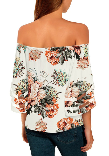 Back view of model wearing white 3-4 bell mesh panel sleeves tie-front off-shoulder floral top
