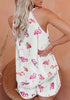 Back view of model wearing white high-neck cami flamingo-print shorts sleepwear set